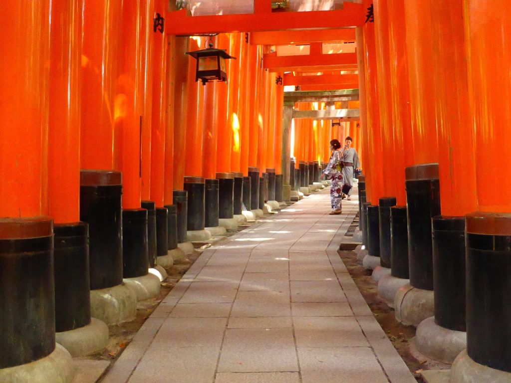 Fushimi Inari torii gates with kimono visitors